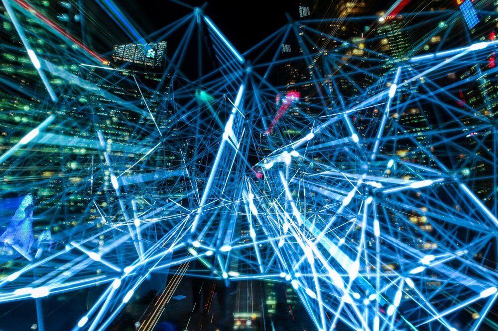 geometric sci fi lasers over city