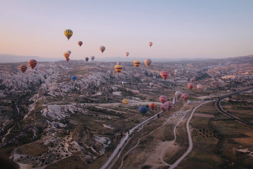 Hot air balloons over mountains